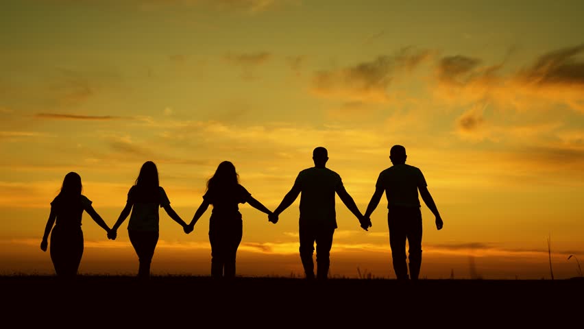 Group of business people outdoors raise their hands to sky. Team of people look at their future together at sunset, park. Human resources. Community of people joint prayer. Unity of group of people Royalty-Free Stock Footage #1107099351