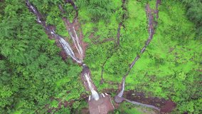 Aerial footage of a monsoon season waterfall near Pune India. Monsoon is the annual rainy season in India from June to September.