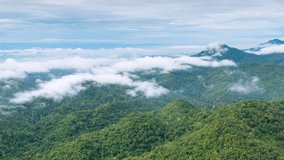 4K motion time lapse video aerial view morning scenery Mist flowing over the high mountains The movement of fog and clouds, Pang Puai, Mae Moh, Lampang, Thailand