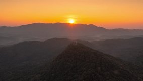 Hyperlapse Video (4K), Beautiful aerial view of a mountain with the sun shining golden, Baan Pang Puai, Mae Moh, Lampang, Thailand.