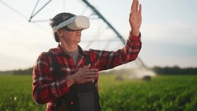 agriculture virtual reality. a farmer in virtual reality glasses controls machine to irrigate corn field. agriculture virtual reality concept. business a farmer vr in works in field with corn - Powered by Shutterstock - Get 15% off with code: PIKWIZARD15