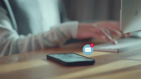 Smart phone mobile receiving mail message, email notification, Woman employee use mobile phone after receiving an email message while sitting at work desk. - Powered by Shutterstock - Get 15% off with code: PIKWIZARD15