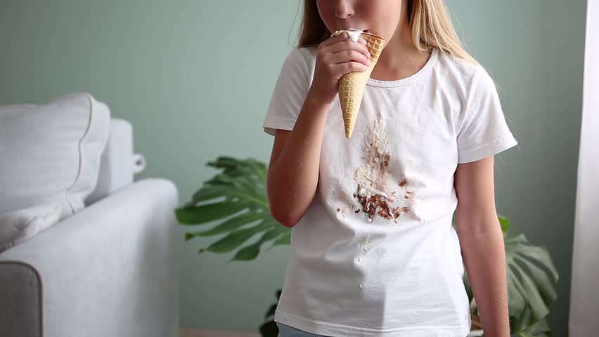The child stained his clothes with ice cream. Royalty-Free Stock Footage #1107122291