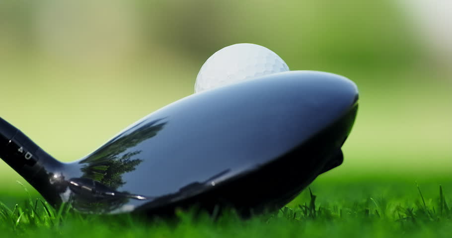 Close up shot of a golf club hitting a ball, close-up, no people. Green grass on the golf course. Sport concept Royalty-Free Stock Footage #1107124675