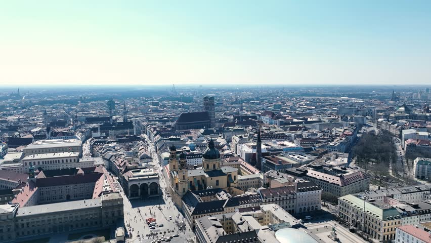 The drone flies sideways above old historical buildings and Feldherrnhalle in Munich Germany Aerial Drone Footage 4k Royalty-Free Stock Footage #1107126925