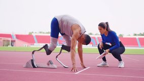 Asian athlete with prosthetic blades and trainer workout in stadium. Attractive amputee male runner and young sportswoman feel happy and enjoy practicing workout for Paralympics running competition. - Powered by Shutterstock - Get 15% off with code: PIKWIZARD15