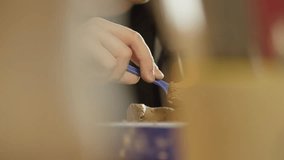 Close-up of a man using a knife to make adjustments to his sculpture. Production of craft products from clay material. High quality 4k footage - Powered by Shutterstock - Get 15% off with code: PIKWIZARD15