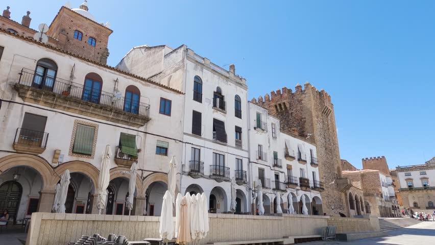 Wide view of plaza mayor, in historic Caceres. Sideways pan. Extremadura, Spain Royalty-Free Stock Footage #1107136189