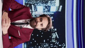 Vertical video Night show presenter opens media segment on live program, creating reportage with latest scandals and famous people. TV journalist hosting talk show at midnight, global communications.