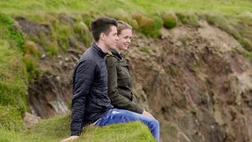 Young couple in love at the Irish west coast - slow motion clip 