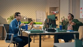 Excited partners tasting food joking at open space. Two laughing guys enjoying lunch break talking together. Friendly designers having fun eating aromatic pizza at office. Corporate work lifestyle - Powered by Shutterstock - Get 15% off with code: PIKWIZARD15