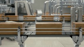 Animation of the automated production process at the industrial facility. Animation of the automated production conveyor carrying packages. Animation of automated production belt moving items. - Powered by Shutterstock - Get 15% off with code: PIKWIZARD15