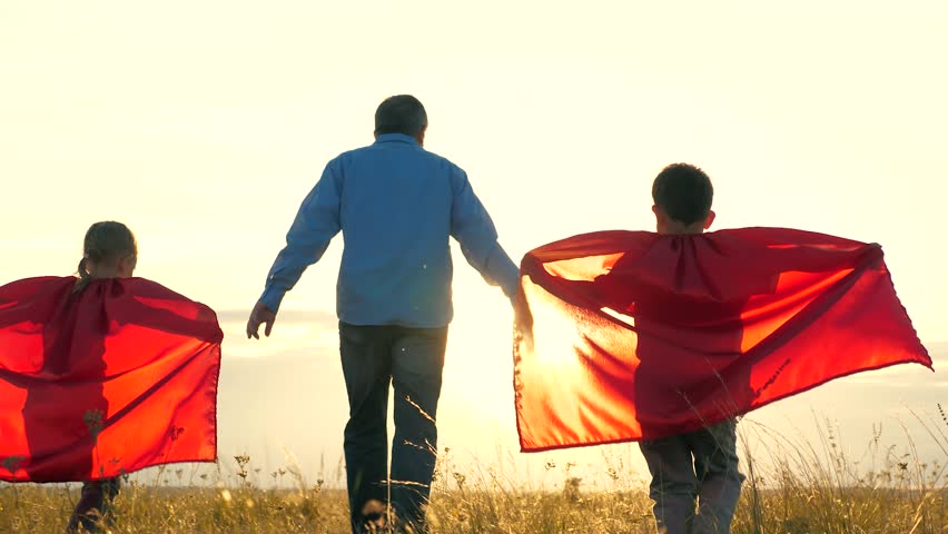 Father kids playing game pretend to be superheroes. Children wear red raincoats dream flying. child boy girl father play together team running running park win game. Father children happy family ran | Shutterstock HD Video #1107174483