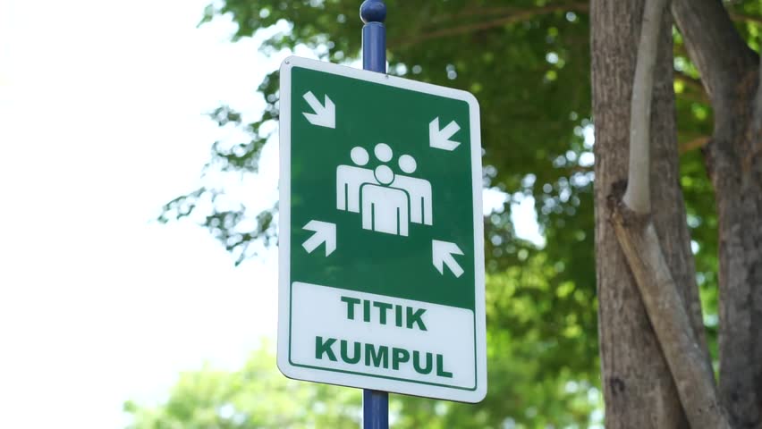 gathering point sign at school park during the day