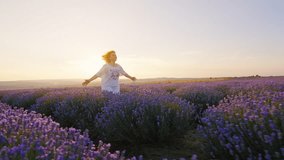 Silhouette Red haired woman runs forward joyfully through lavender field smiling in white dress touching blooming lavender flowers with her hands on walk in summer sunset. Lifestyle. Relax golden hour - Powered by Shutterstock - Get 15% off with code: PIKWIZARD15