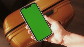 Hands of traveller using smartphone for connecting, using app. Tourist waiting for boarding for vacation in airport. Green screen concept. - Powered by Shutterstock - Get 15% off with code: PIKWIZARD15