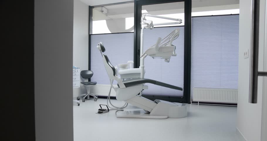 Modern Room with dental chair and medical equipment. Concept of dental care. Dental chair and other accessories. Dental clinic equipment. Royalty-Free Stock Footage #1107176595