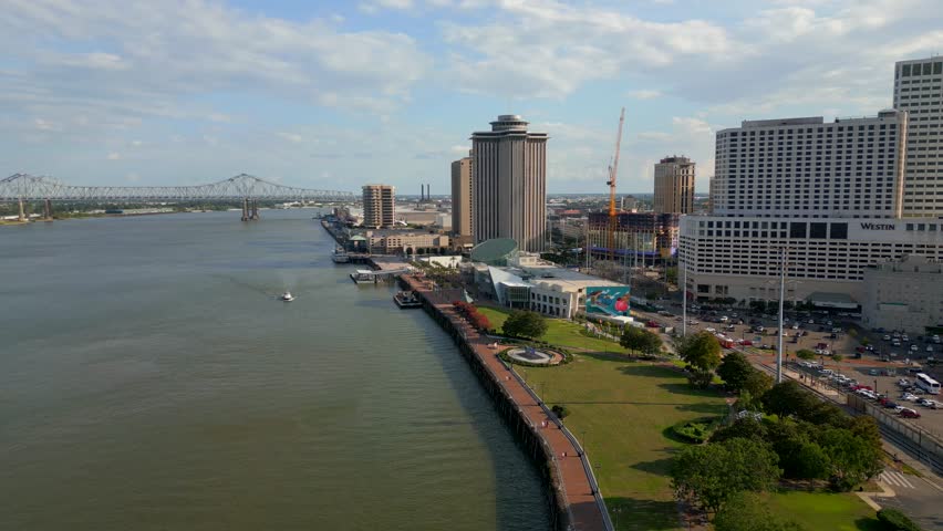 New Orleans, LA, USA - July 23, 2023: Aerial video New Orleans riverwalk Mississippi River and park scene