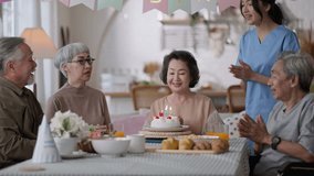 Senior woman birthday.group of asian older female and elder male laugh smile conversation greeting in birthday friend party at nursing home senior daycare center,birthday party at senior daycare. - Powered by Shutterstock - Get 15% off with code: PIKWIZARD15