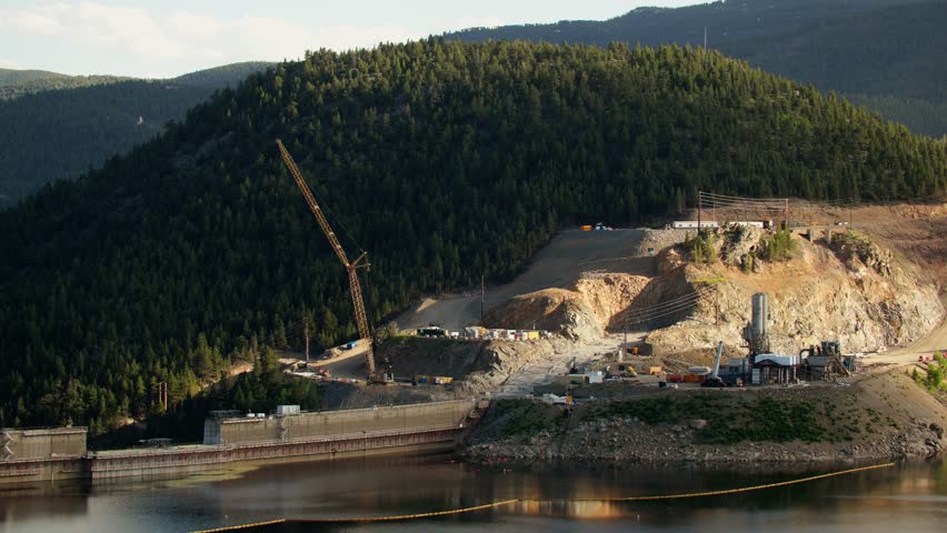 A construction crane working on the dam at Gross Reservoir in Boulder County, Colorado, USA. Locked tele shot