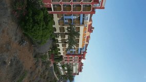 cozy colorful town with houses, hotels and resorts on cliff, Tenerife, Canary