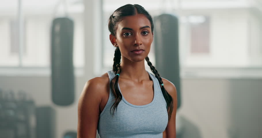 Happy woman, face and arms crossed in gym for fitness workout, exercise or healthy wellness. Portrait, female person and proud Indian sports girl ready for training at a boxing club with confidence