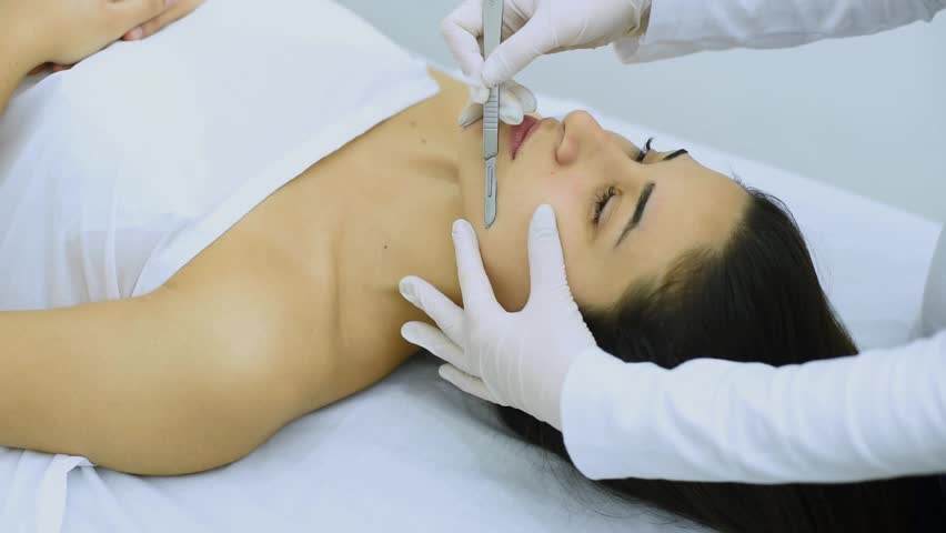 beauty treatment and cosmetology in an aesthetic center with the dermaplaning technique for the health and aesthetics of the skin Royalty-Free Stock Footage #1107186523