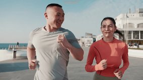 Handsome multicultural couple jogging by sea at dawn - Powered by Shutterstock - Get 15% off with code: PIKWIZARD15