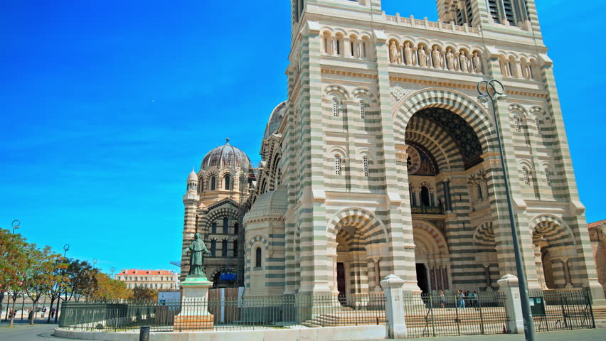 Tourists visiting the Basilica of Notre-Dame of la Garde in Marseille. Grand cathedral at the city
