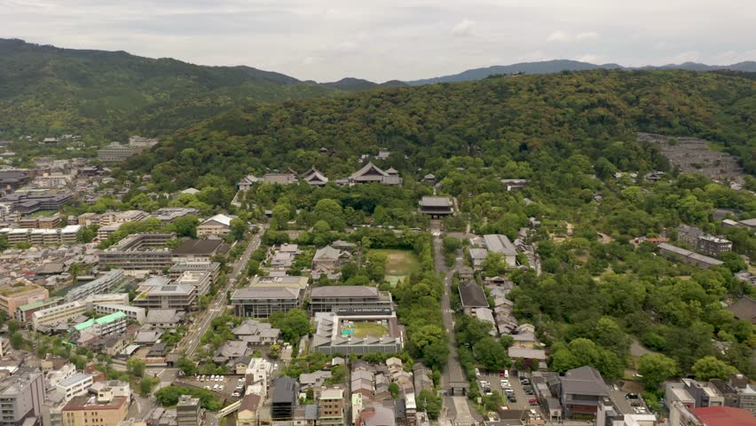 Colorful wide aerial of Kyoto with temples, mountains, and city skyline in Kyoto, Japan.