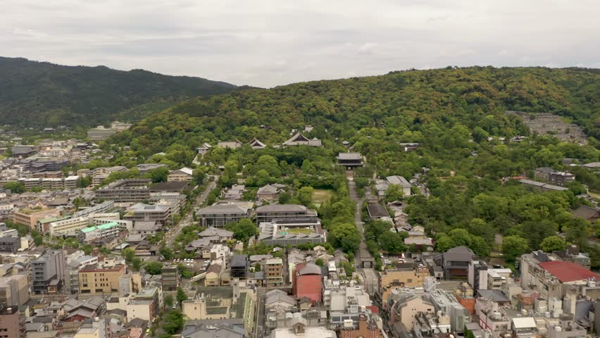 Colorful aerial of Kyoto with temples, mountains, and city skyline in Kyoto, Japan.