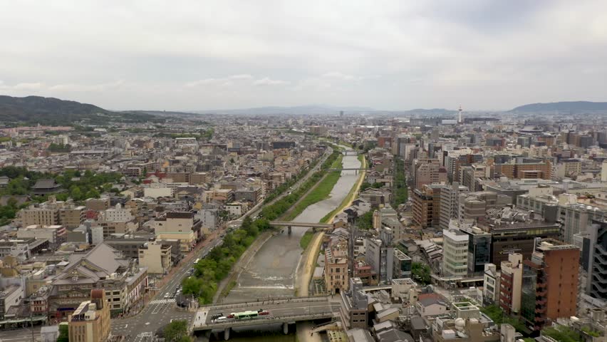 Aerial of Kyoto with Kamo river, temples, mountains, and city skyline in Kyoto, Japan.