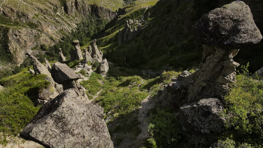 Aerial view of natural rock formations Stone mushrooms in the Altai Nature Reserve in the Chulyshman River valley. Soil erosion. Tourist attraction. Close up