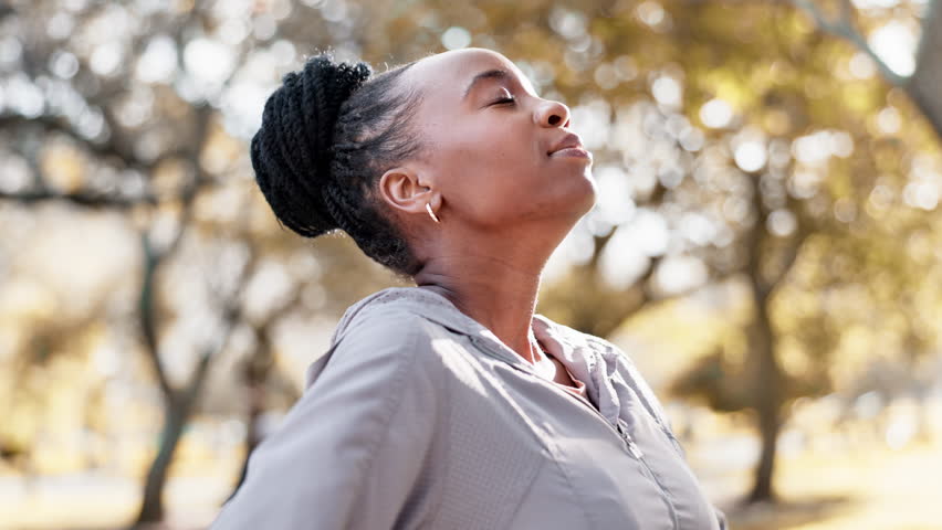 Black woman, breathing and nature, meditation and happy outdoor with fitness, peace and calm with mindfulness. African person in the park, fresh air and zen with exercise, health and wellness Royalty-Free Stock Footage #1107199795