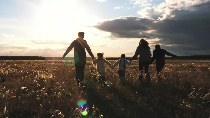 child mother father, big happy family run sunset, take hand, run group team, children game, superhero plane pilot, against backdrop sunset sky, big happy family, achievement, carefree childhood Royalty-Free Stock Footage #1107204935