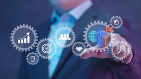 Businessman pointing virtual screen of gear cog icon present operation management involving business process, workflow, problem solving, high performance, monitoring and evaluation, quality control. - Powered by Shutterstock - Get 15% off with code: PIKWIZARD15