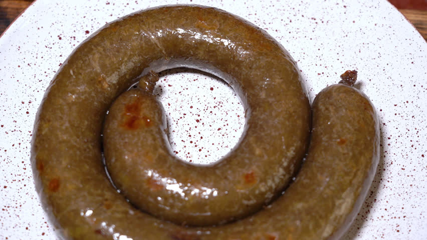 Fried onions with sour cream are placed on the cooked homemade sausage | Shutterstock HD Video #1107210313