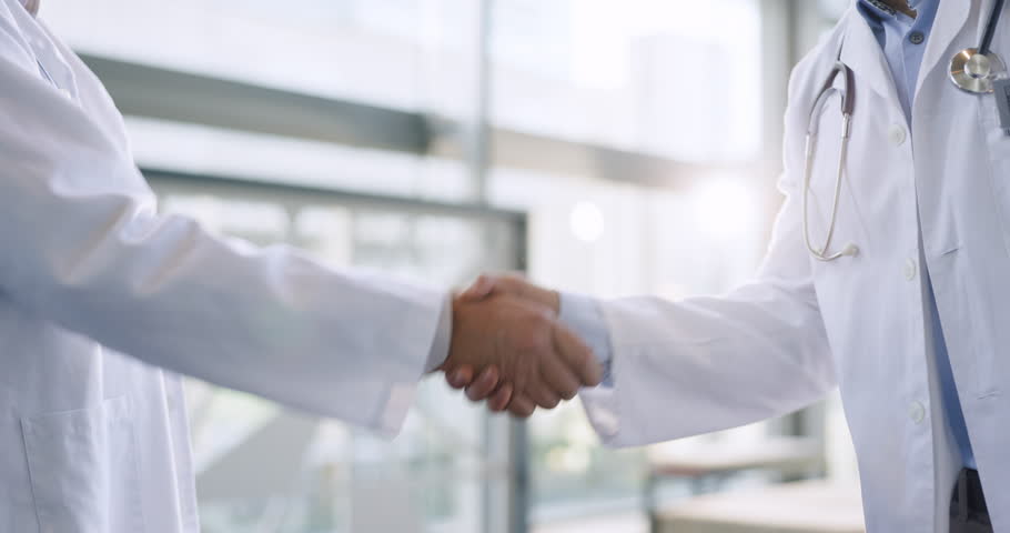 Hands, teamwork or doctors shaking hands for success, good job or promotion goal in a hospital meeting. Closeup, congratulations or proud healthcare worker with handshake for medical collaboration Royalty-Free Stock Footage #1107213905