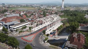 The drone view of TESDA bridge in Purwokerto, Central Java, Indonesia. This aerial video was taken on August 9, 2023 by a professional. This video contains a beautiful bridge in town