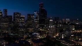 Establishing Aerial View Shot of Seattle at night evening WA, Washington US, super clear image, slow tracking left, magnificent view