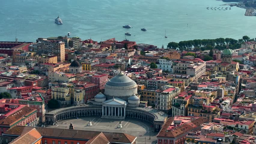 A view of Napoli, Italy, Aerial view of the historic center, panoramic drone view of the entire city of Italy. Flight over historical landmarks, narrow streets and buildings with colour rooftops Royalty-Free Stock Footage #1107221265