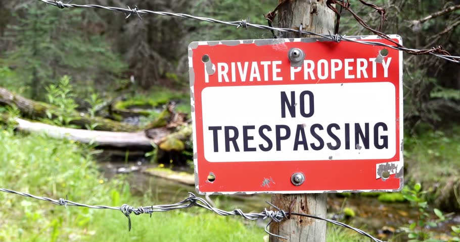 A sign in a rural area with the text: Private Property No trespassing.  Royalty-Free Stock Footage #1107223595