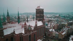 Vertical Video. Aerial View of the Antique Town in Winter. Beautiful Architecture in the City. Breathtaking View from the Drone in Gdansk, Poland. Tourism Concept