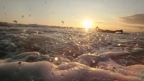 Surfing at Sunset. Outdoor Active Lifestyle. Portrait of surfer woman surfing having fun on Bali, Indonesia. Female bikini girl in water during surfing surfboard smiling happy living healthy lifestyle - Powered by Shutterstock - Get 15% off with code: PIKWIZARD15