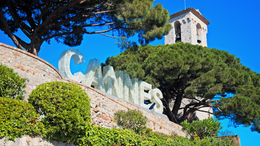 Cannes on the French Riviera, Cote d'Azur. Sign Cannes written with light bulbs on a top of a mountain in the Notre Dame d'Esperance church.  Royalty-Free Stock Footage #1107228979