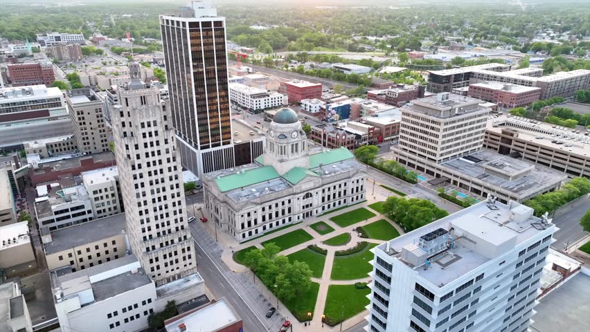 Aerial video circling around Allen County Courthouse slowly at sunrise