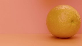 Water drips flowing from a sliced sweet and fresh orange down on a yellow background, fruit for frash and natural juice, cold diet drink with vitamin c. Slow motion, filmed on cinema camera, 4K. - Powered by Shutterstock - Get 15% off with code: PIKWIZARD15