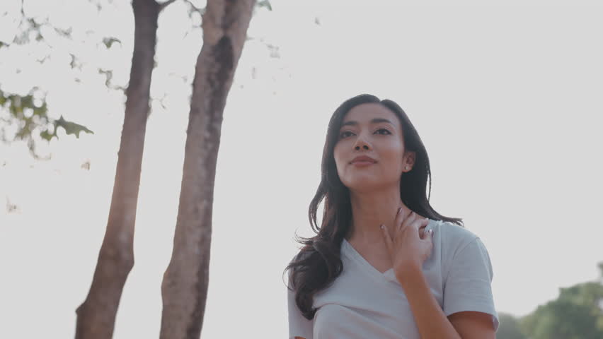 Fitness woman stretching before or after workout, Asian fit girl workout exercise in the morning at nature park outdoor, sport fitness lifestyle for athlete body to wellness healthy