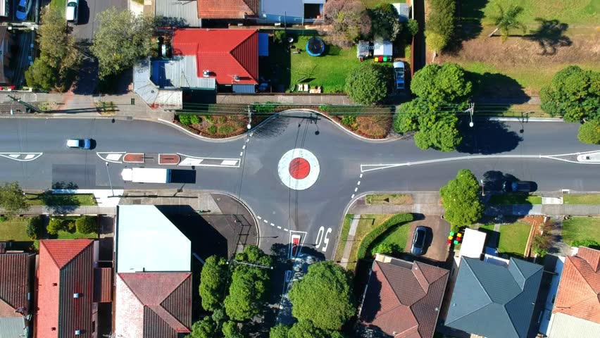 Aerial Drone panoramic view of Sydney NSW Australia city Skyline and looking down on traffic round about cars passing through Royalty-Free Stock Footage #1107237133