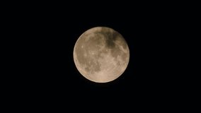 the moon at night and the dark clouds drifting from the moon's surface, the full moon and dark clouds in motion, - Powered by Shutterstock - Get 15% off with code: PIKWIZARD15